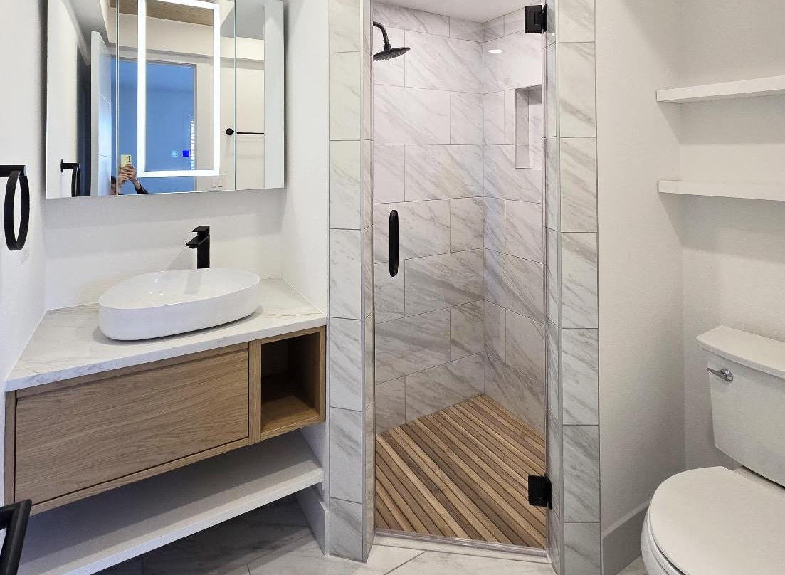 Custom-built solid teak mat with oiled finish in shower