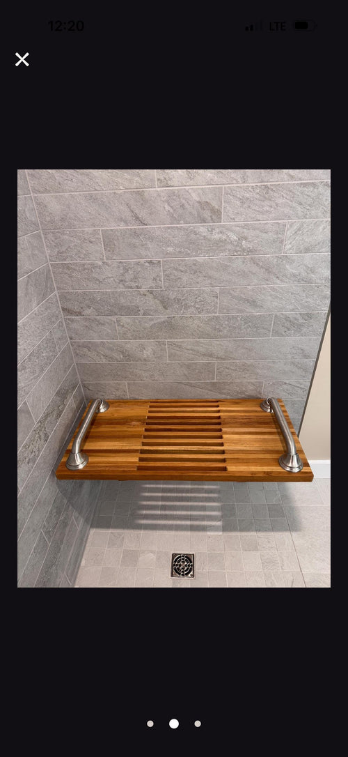 Folding teak shower bench with stainless steel grab bars from front