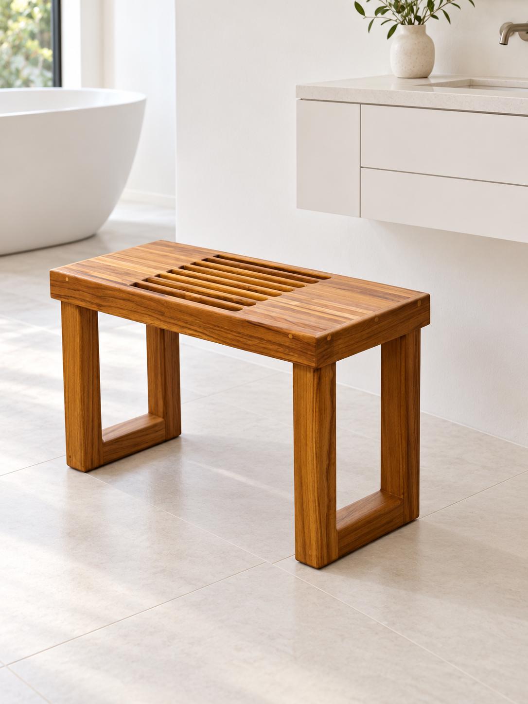 A Freestanding Teak Shower bench in a white tiled Bathroom